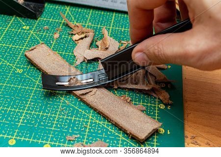 Thinning Brown Leather Stripe With Skiver Tool. Leather Craft Hobby