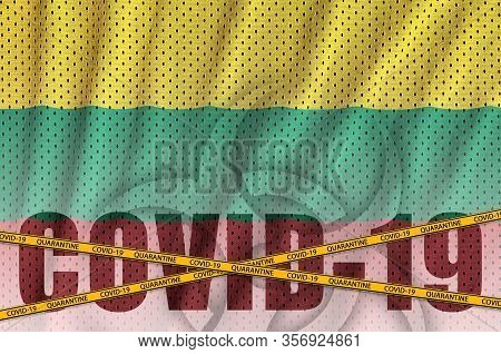 Lithuania Flag And Covid-19 Inscription With Orange Quarantine Border Tape. Coronavirus Or 2019-ncov