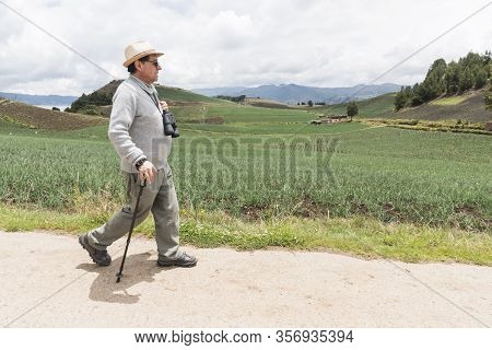 Aquitania, Boyaca / Colombia; April 8, 2018: Man Walking Along A Path Surrounded By Welsh Onion Fiel