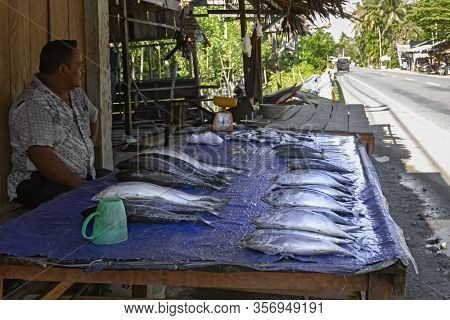 Parapat, Indonesia - January 4, 2020. Fresh Fish Trade On A Street Tray Near A Highway
