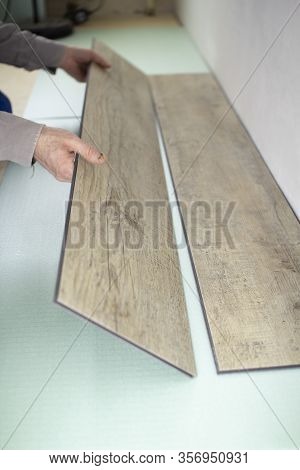 Vinyl Laminate. Laying Of The Floor Covering.