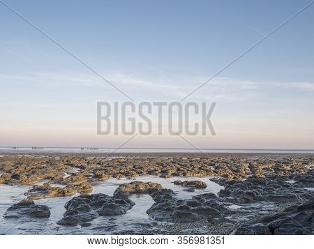 Aerial View Of Horizon Over Sea, With Mounds Of Mud In The Foreground, National Park And Unesco Worl