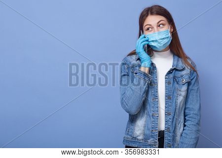 Image Of Darkhaired Female Wearing Casual Outfit, Disposable Medical Flumask And Protective Gloves, 