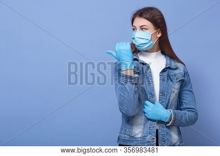 Close Up Portrait Of Beautiful And Young Woman Wearing White Shirt And Denim Jacket, Blue Rubber Glo