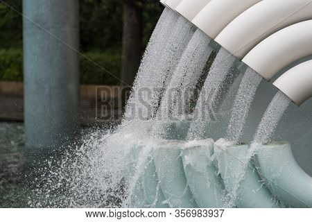 Water Flowing From White Tubes, Pipes Background.