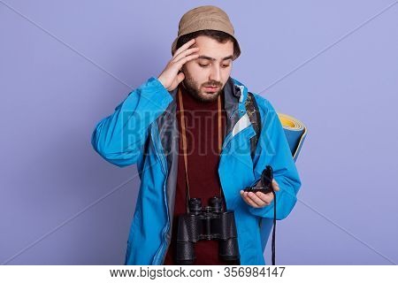 Close Portrait Of Hiker With Backpack And Rolled Up Karemat, Posing Isolated Over Lilac Background, 