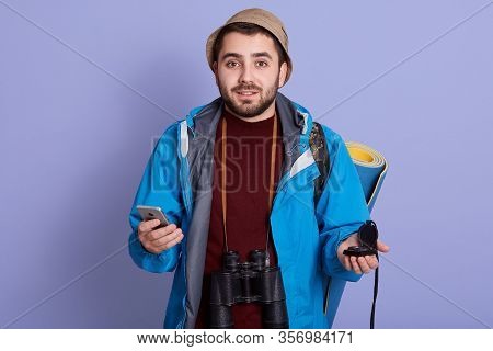 Close Up Portrait Of Smiling Male Hiker With Backpack, Binoculars, Kompas, Using Mobile Phone, Tryin