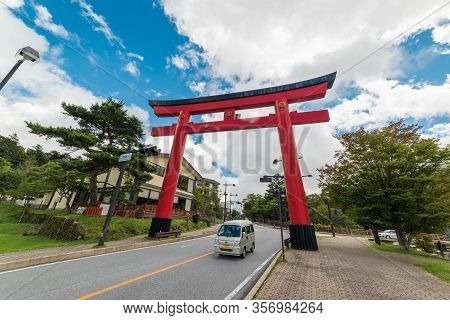 Togichi, Japan - September 9, 2016: Red Torii Gate On The Road To Nikko Town In Japan