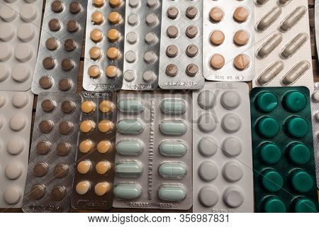 Closeup Shot Of Different Pills On Table With Tablets , Pharmaceutical Industry Concept