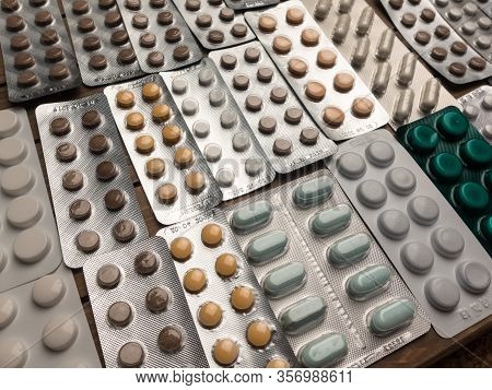 Closeup Shot Of Different Pills On Table With Tablets , Pharmaceutical Industry Concept