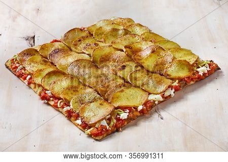 Tart Flambe Or Flammkuchen On Wooden Cutting Board, Traditional Alsatian Pie, Rustic Style, Top View