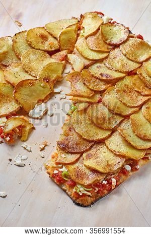 Tart Flambe Or Flammkuchen On Wooden Cutting Board, Traditional Alsatian Pie, Rustic Style.
