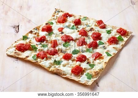 Traditional Tarte Flambee With Creme Fraiche, Tomato And Cheese