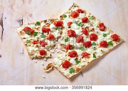 Traditional Tarte Flambee With Creme Fraiche, Tomato And Cheese
