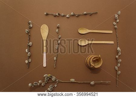 Wooden Kitchen Spoons On A Brown Paper Background. Concept Of Eco Tools, No Plastic. Ziro Waste