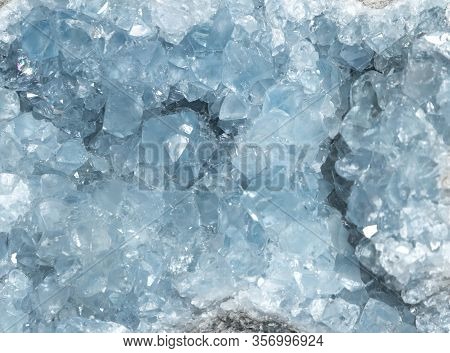 Sparkly Blue Celestite Geode Crystal Background Texture.