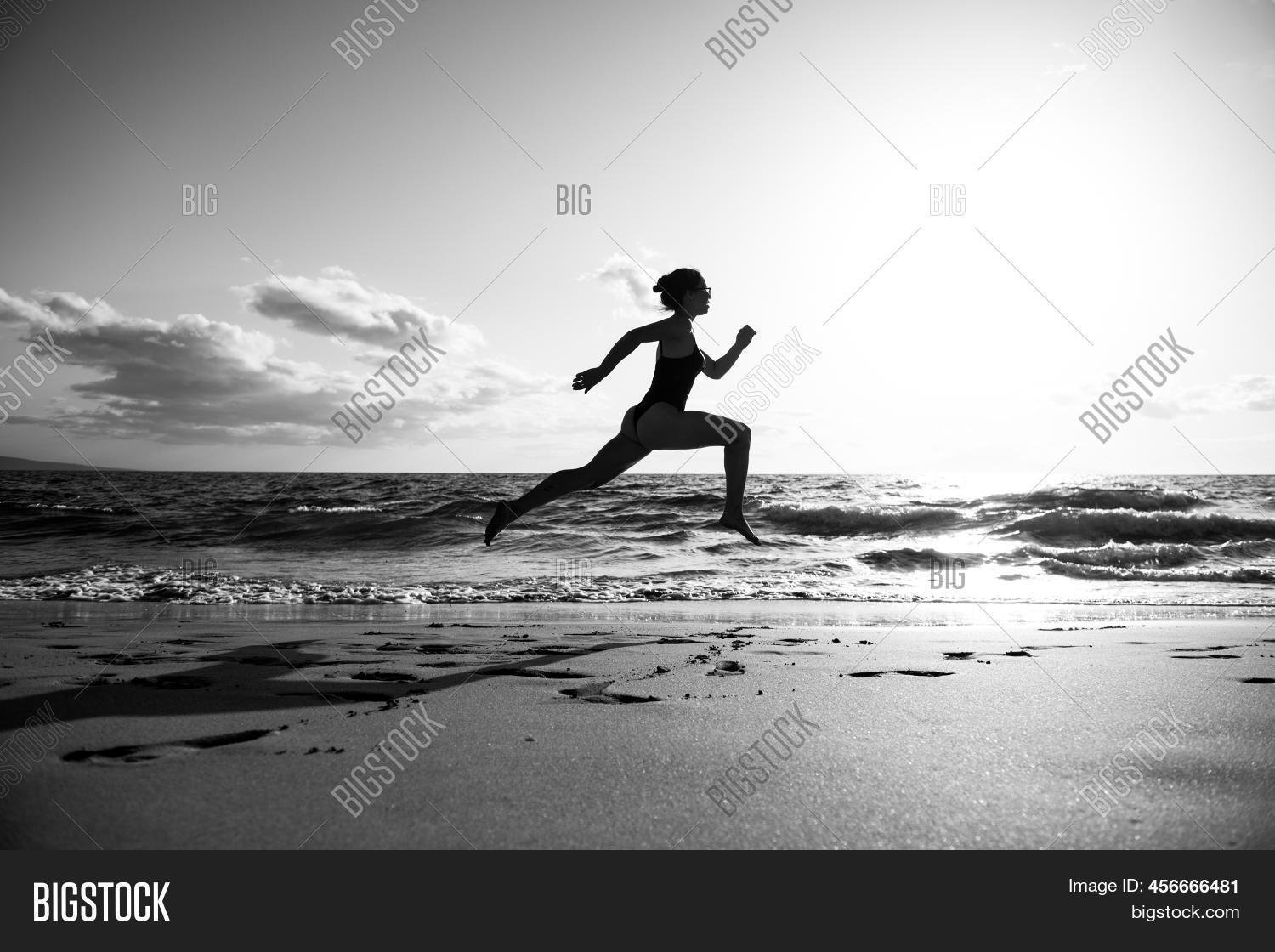 Woman Running On Beach Image & Photo (Free Trial) Bigstock