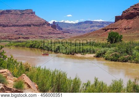 Raft Going Down Colorado River In Utah Desert Canyon. La Sal Peak, Mount Waas, Castle Mountain Cover