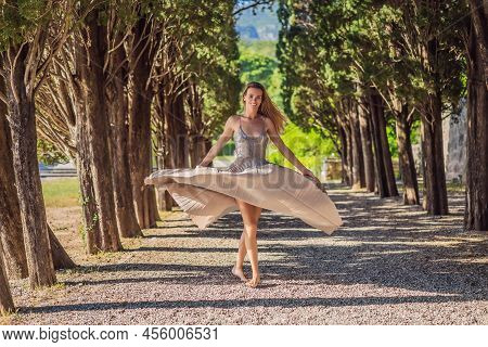 Woman Tourist Walking In Montenegro. Panoramic Summer Landscape Of The Beautiful Green Royal Park Mi