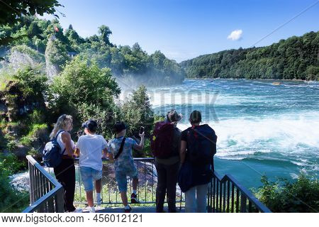 Neuhausen Am Rheinfall, Switherland - May 26, 2022: Tourists At Rheinfall Observation Deck On May 26