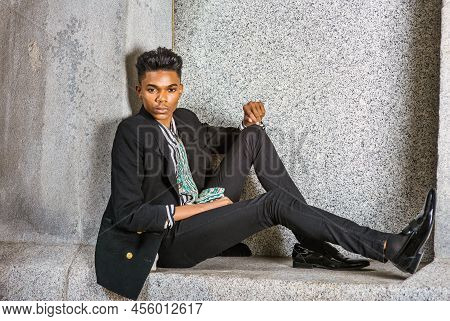 A Young 18 Years Old Black American Student, Wearing Fashionable Blazer, Pants, Leather Shoes, Sitti