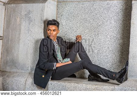 A Young 18 Years Old Black American Student, Wearing Fashionable Blazer, Pants, Leather Shoes, Sitti
