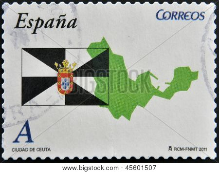 En stämpel som tryckt i Spanien visar flaggan och karta över den autonoma staden Ceuta