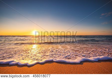 Beautiful Sunrise Over The Sea Waves And Beach. Islnad In The Ocean
