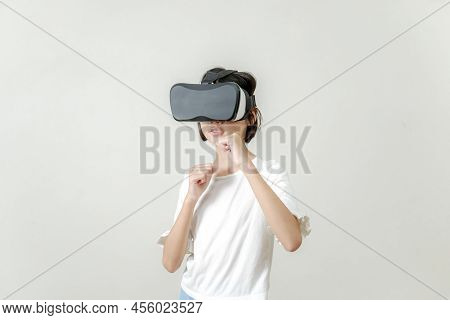 Asian Child Girl With Boxing In Vr Headset Training For Punch In Virtual Reality, Playing Vr Game Me