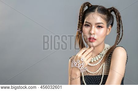 Portrait Of Smiling Cheerful Beautiful Pretty Asian Fashion Woman Posing Smile In Black Fashion Clot