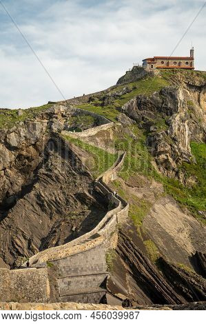 Stone Footpath To Famous Landmark And Film Location In North Of Spain, Ocean Islet With Chapel San J