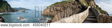 Stone Footpath To Famous Landmark And Film Location In North Of Spain, Ocean Islet With Chapel San J