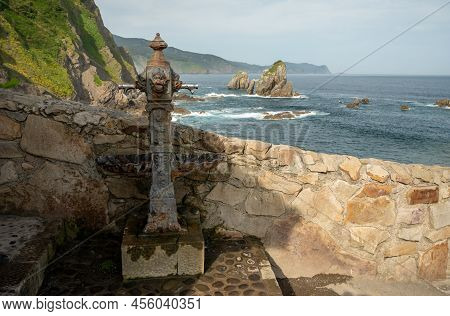 Stone Footpath To Famous Landmark And Film Location In North Of Spain, Ocean Islet With Chapel San J