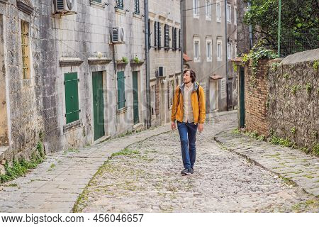 Man Tourist On Background Of Scenic Panorama View Of The Historic Town Of Risan At Famous Bay Of Kot