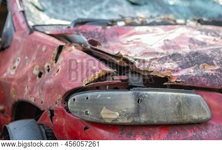 Car Riddled With Bullets. War Of Russia Against Ukraine. A Car Of Civilians Shot By The Russian Mili