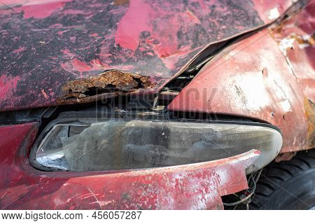 Broken Headlights As A Result Of A Collision. Broken Red Car After An Accident. Car Accident Concept