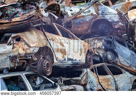 Russian Invasion Of Ukraine In 2022, Destroyed And Burned Cars. Cars Were Beaten With Shrapnel And B