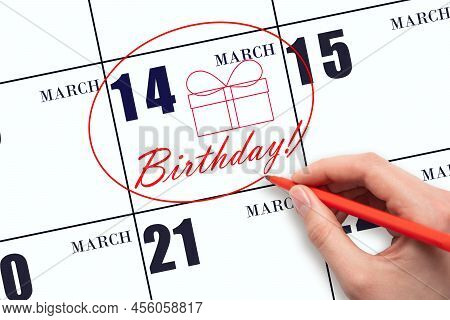 14th Day Of March. The Hand Circles The Date On The Calendar 14 March, Draws A Gift Box And Writes T