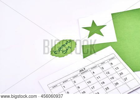 Esperanto Day Concept. Top View Flat Lay. Calendar And Flag Of Esperanto On White Background.
