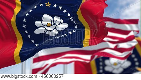 The Mississippi State Flag Waving Along With The National Flag Of The United States Of America. Miss