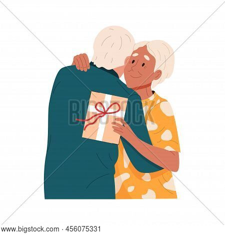 Happy Senior Family Couple Hugging. Cute Elderly Husband Giving A Gift Box To Wife On Romantic Date.