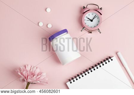 Women Health, Middle Age And Menopause Concept. Health Care Style. Copy Space. White Plastic Bottle 