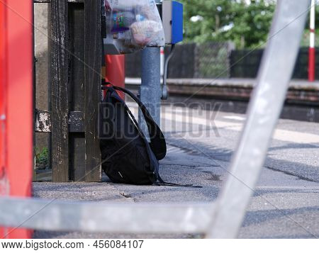 Rucksack Left On Railway Platform Wide Shot
