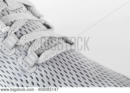 New Unbranded Running Sneaker Or Trainer On White Background. Men's Light Grai Sport Footwear. Close