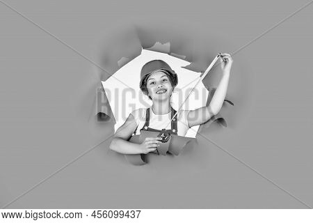 Self-retracting Metal Tape Measure. Little Girl Using A Measuring Tape. Construction Worker With Tap
