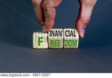 Financial Freedom Symbol. Concept Words Financial Freedom On Wooden Cubes. Businessman Hand. Beautif