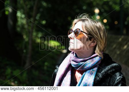 Attractive Thirty Year Old Woman Posing In The Sun, In A Brussels Citypark During Spring, Brussels, 