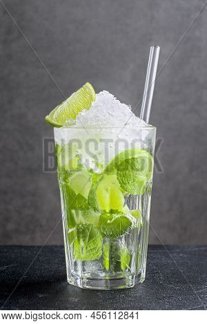 Fresh Mojito Made Of Fresh Citrus Fruit And Green Mint Leaves. Glass With Delicious Beverage With Cr