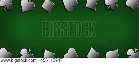 Different Card Suits, On A Green Background. Copy Space. Place For Text. Gambling Concept. Gambling 
