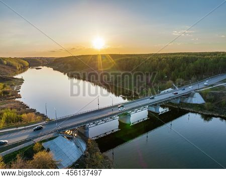 Beautiful View Of The Bridge Across The Iset River In The City Of Kamensk-uralsky At Sunset In Sprin